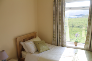 A bedroom at Atlantic View - Barra Holiday Cottage